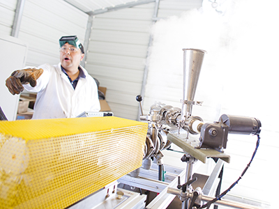 Professor Gerardo Diaz performing plasma gasification research in a lab