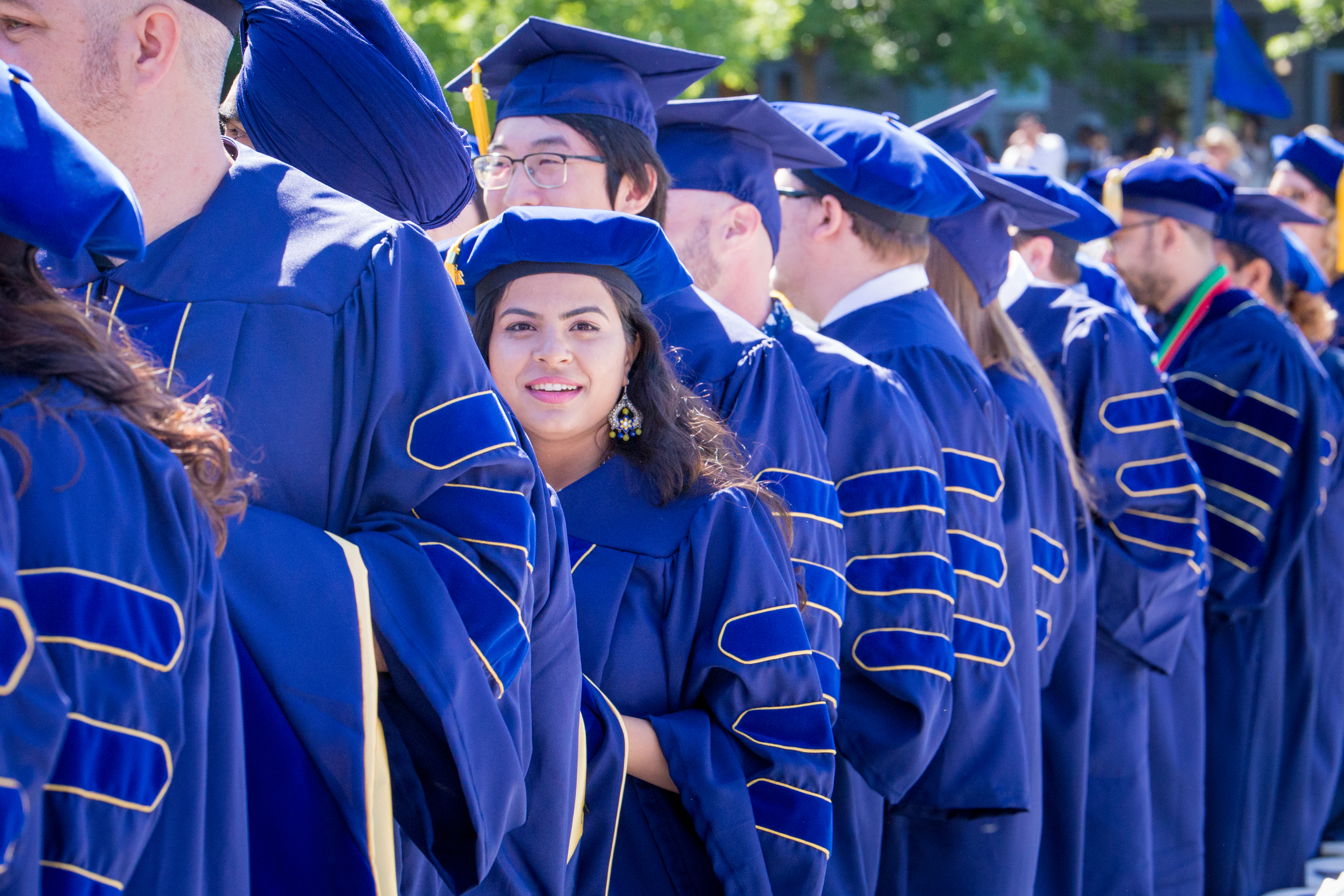 Graduates standing in a line.