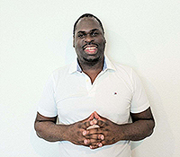 Black male in a white polo shirt