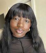 female with dark hair wearing black shirt