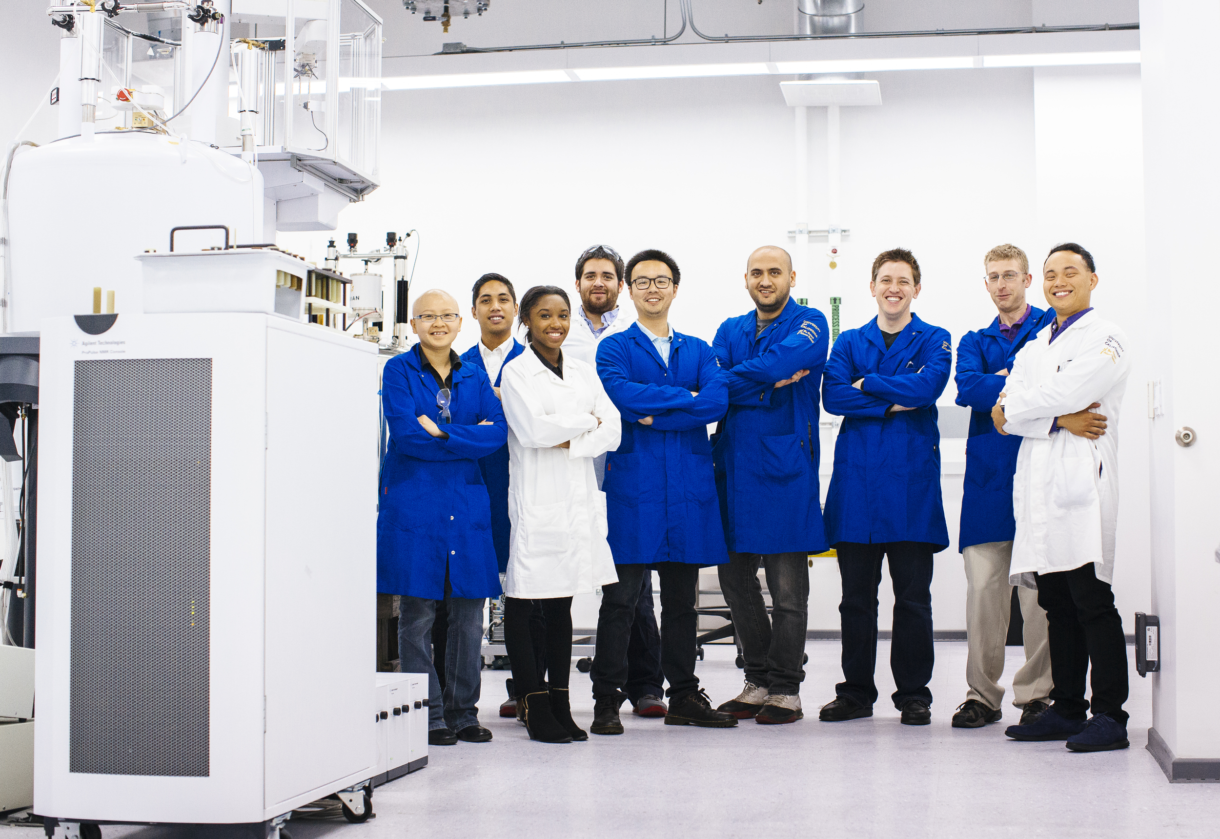 Group of students and faculty standing in a lab.