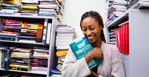 female student in the library studying
