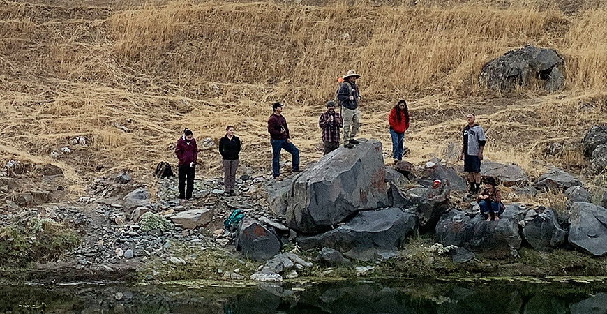 Group of people standing on rocks