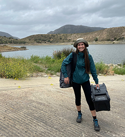 graduate student Shelby Defeo in the field