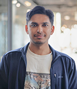 male wearing white t shirt with dark blue jacket