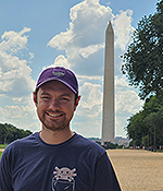 Male in blue t shirt and baseball cap