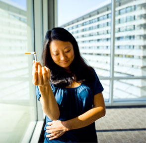 Professor Anna Song holding a cigarette