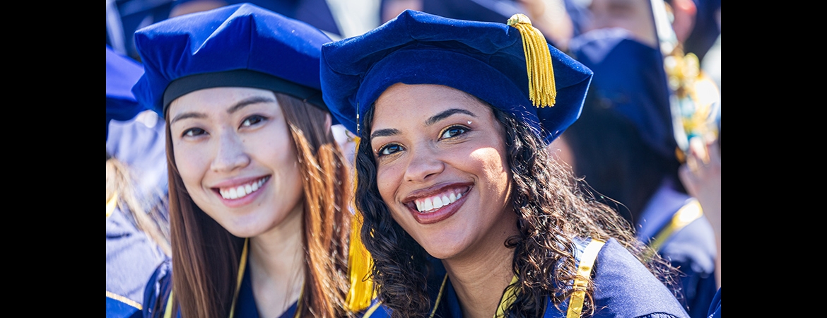 Doctoral degree graduates at UC MErced commencement wearing cap and gown